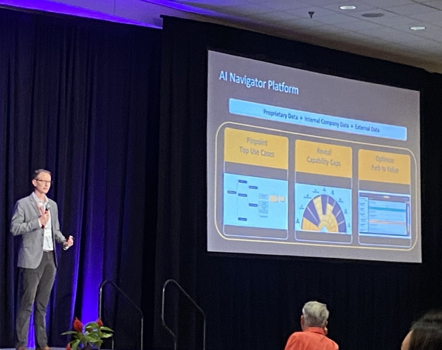 Vince Stuntebeck pitching NavAlytix's AI Navigator Platform on stage at Grep-a-Palooza